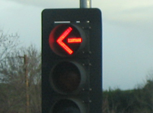 a traffic light that has a green arrow